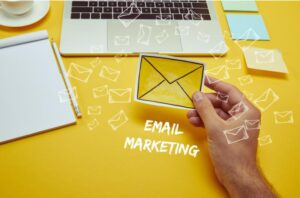 A visual representation of email marketing, showcasing email icons, analytics charts, and communication tools for effective campaigns.